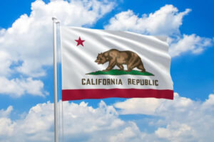 California flag waving in the wind on clouds sky.